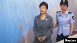 FILE - Former South Korean President Park Geun-hye arrives at a court in Seoul, South Korea, Aug. 25, 2017.