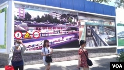 The construction banner at a future metro stop in Ho Chi Minh City. (Lien Hoang for VOA News)