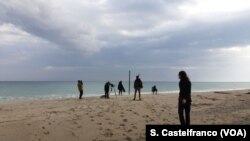Team shooting with migrants on Stignano beach, Calabria, Italy. 