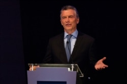 FILE - Argentine President Mauricio Macri speaks during a presidential candidates debate, in Santa Fe, Oct. 13, 2019.