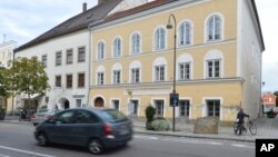FILE - This Sept. 27, 2012, photo shows an exterior view of Adolf Hitler's birth house, front, in Braunau, Austria.