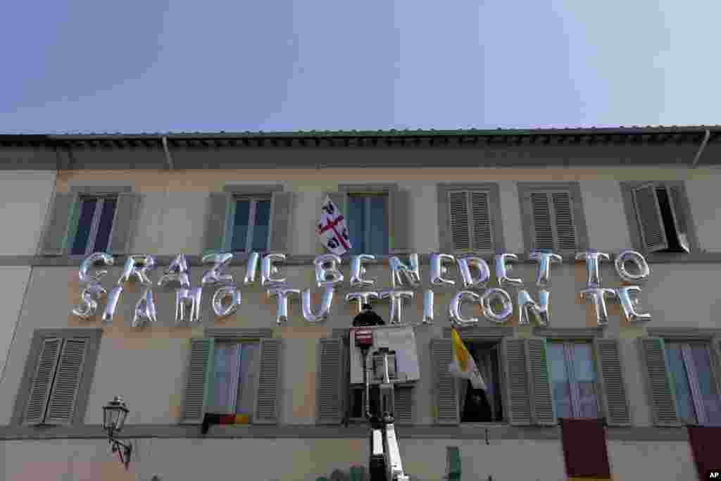 Inflatable letters compose the message "Thank You Benedict, we are all with you" in the town of Castel Gandolfo, south of Rome, Feb. 28, 2013. 