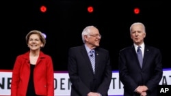 FILE - Then-Democratic presidential candidate Sen. Elizabeth Warren, D-Mass., waves to supporters and volunteers, Feb. 29, 2020, in Columbia, S.C.