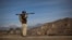 FILE - A Pakistani soldier holds a rocket launcher while securing a road in the town of Khar, in Pakistan's Federally Administered Tribal Areas (FATA), March 2, 2010. The FATA areas now have become part of Pakistan's Khyber Pakhtunkhwa province. 