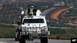 Spanish U.N. peacekeepers patrol the Lebanese Israeli border in the southern village of Odaisa, Lebanon, Aug. 29, 2013. 