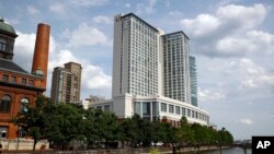 FILE - Marriott Hotel in Baltimore's Harbor East district, June 29, 2017. In sales brochures, a U.S. company boasted of the “stunning visual effect” its shimmering aluminum panels created in a 33-story hotel on Baltimore’s waterfront. Those same panels also were used in London’s Grenfell Tower. 