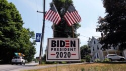A car passes a yard displaying a campaign sign for Democratic presidential candidate, former Vice President Joe Biden on June 23, 2020 in North Hampton, New Hampshire.