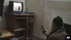 FILE - This undated image from video, seized from the walled compound of al-Qaida leader Osama bin Laden in Abbottabad, Pakistan, and released by the U.S. Department of Defense, May 7, 2011, shows a man, identified as Osama bin Laden, watching then-president Barack Obama on his television.