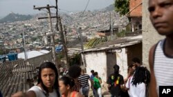 Residents gather in the Complexo da Penha slum in Rio de Janeiro, Brazil, Aug. 22, 2018. Last year 523 workers were found in slavery-like conditions during labor inspections in Brazilian cities, about 225 more than in 2017 according to government data.