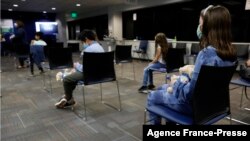 Children wait 15 minutes after receiving there first dose of the Pfizer Covid-19 vaccine at the Beaumont Health offices in Southfield, Michigan, Nov. 5, 2021. 