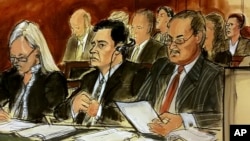 In this courtroom sketch, Mehmet Hakan Atilla, second from left, listens to the judge during his sentencing, flanked by his attorneys Cathy Fleming, left, and Victor Rocco, May 16, 2018, in New York. Atilla's wife, upper right in the sketch, also listens to the proceedings.