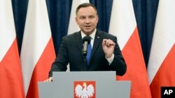 Polish President Andrzej Duda announces his decision to sign a legislation penalizing certain statements about the Holocaust, in Warsaw, Poland, Feb. 6, 2018. Duda said that he will also ask the constitutional court to make final ruling on the disputed Holocaust speech bill.