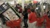 File — Early bird shoppers snatch up flat screen televisions at the Target store in Mayfield Hts., Ohio, on Black Friday.