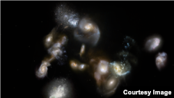 Astronomers recently discovered a group of interacting and merging galaxies in the early universe, as seen in this artist’s illustration. (Credit: ESO/M. Kornmesser)