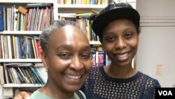 Mahen Bonetti, the founder of the African Film Festival (L), with Abessi Akhamie, director of Still Water Runs Deep. (VOA/ A. Phillips)