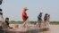 Villagers are fishing in Tonle Sap Lake in Kampong Chhnang province’s Chhnuk Trou, on March 12, 2020. (Sun Narin/VOA Khmer)