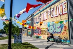 A book store is boarded up following protests against the death of George Floyd, in Minneapolis, Minnesota, June 5, 2020.