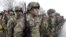 FILE - U.S. troops military troops line up in November 2015. Authorities say two Afghan men getting military training in the United States are missing.