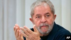 FILE - Brazil's former President Luiz Inacio Lula da Silva attends an extraordinary Worker's Party leaders meeting in Sao Paulo, Brazil, March 30, 2015. 