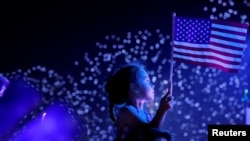 FILE - A child watches the Macy's Fourth of July fireworks in New York City, New York, U.S., July 4, 2021. (REUTERS/Andrew Kelly)