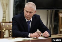 Bivši visoki komandant plaćeničke grupe "Vagner" Andrej Trošev tokom sastana sa predsednikom Rusije Vladimirom Putinom i zamenikom ministra odbrane Junus-Bek Jevkurovim, u Kemlju, u Moskvi, Rusija, 28. septembra 2023.