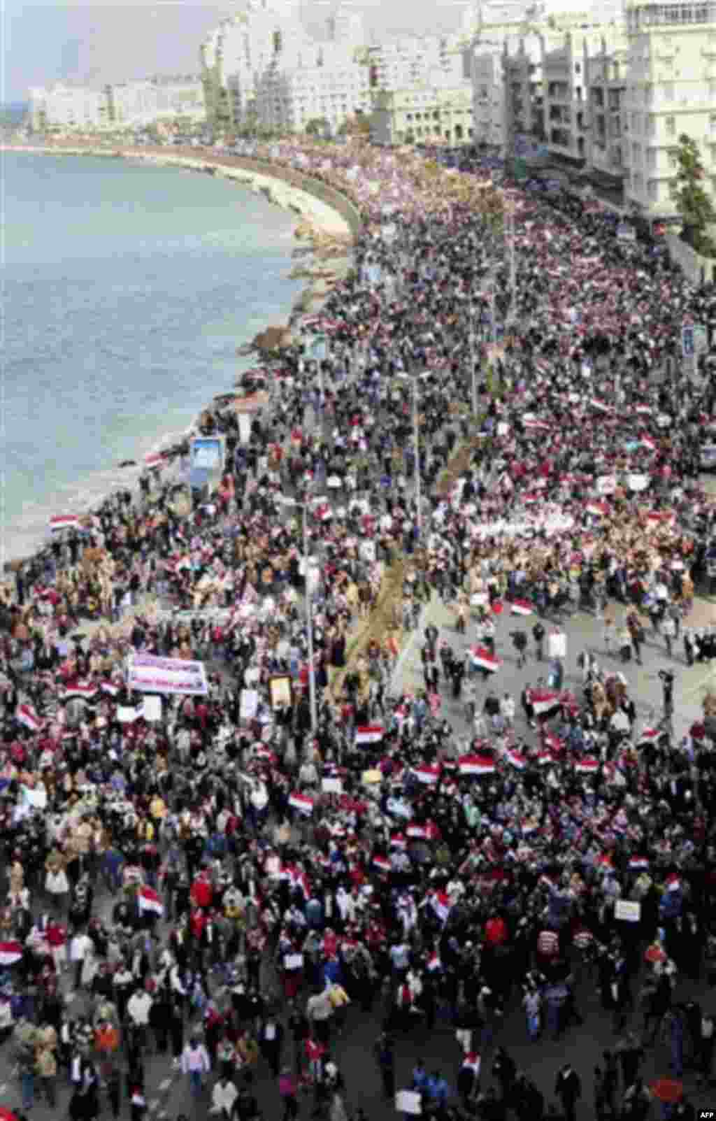 Thousands of Egyptian anti-government protesters march in Alexandria, Egypt, Friday, Feb. 11, 2011. Mubarak has refused to step down or leave the country, and instead handed his administrative powers to his vice president Omar Suleiman on Thursday, rema