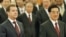 Russian President Dmitry Medvedev, left, with his Chinese counterpart Hu Jintao arrives for a welcoming ceremony at the Great Hall of the People in Beijing, 27 Sept. 2010