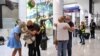 People reunite at Sydney Airport in the wake of COVID-19 border restrictions easing, with fully vaccinated Australians being allowed into Sydney from overseas without quarantine for the first time since March 2020, in Sydney, Australia, November 1, 2021.