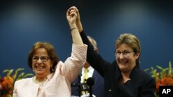 Beth Asaro, left, and Joanne Schailey celebrate after exchanging vows to become the first same-sex couple married in Lambertville, N.J. history at 12:01 a.m. Monday, Oct. 21, 2013.