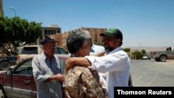 People celebrate the liberation of their city from the eastern forces led by Khalifa Haftar, in Gharyan.