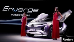 Models pose with the GAC Enverge electric concept car at the North American International Auto Show in Detroit, Michigan, Jan. 15, 2018. 