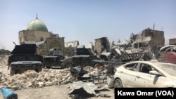 FILE - Much of the Old City of Mosul lay in ruins as Iraqi forces battled Islamic State militants for the city. The destroyed al-Nuri mosque, in the background, illustrated the level of destruction in the city, July 1, 2017.