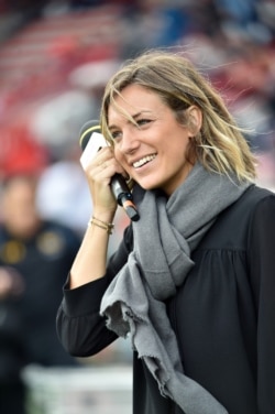 FILE - French journalist Clementine Sarlat covers the European Champions Cup rugby union match between Toulouse and Wasps, in Toulouse, Oct. 23, 2016.