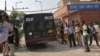 A police vehicle carrying four men accused of the gang rape of a 23-year-old woman on a bus on December 16, enters a court in New Delhi, September 10, 2013. 