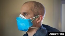 Jeremy Filko of Virginia wears one of his 3D-printed shields over a medical mask. (Photo courtesy of Jeremy Filko)