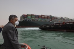 Osama Rabie, Chairman of the Suez Canal Authority, monitors the situation near stranded container ship Ever Given, one of the world's largest container ships, after it ran aground, in Suez Canal, Egypt, March 25, 2021.