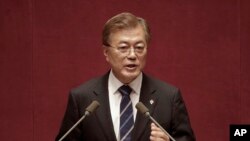 FILE - South Korean President Moon Jae-in delivers a speech at the National Assembly in Seoul, South Korea.