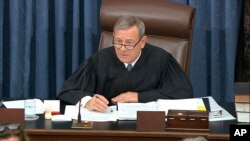 In this image from video, presiding officer Supreme Court Chief Justice John Roberts speaks during the impeachment trial against President Donald Trump in the Senate at the U.S. Capitol in Washington, Tuesday, Jan. 21, 2020. (Senate Television via AP)