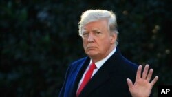 FILE - President Donald Trump waves as he leaves the White House in Washington, Oct. 24, 2018, to attend a campaign rally in Mosinee, Wis. 