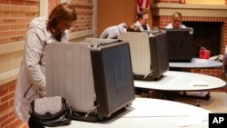Voters cast their ballots in the Indiana primary at Holy Trinity Greek Orthodox Church in Carmel, Indiana, May 3, 2016. 