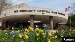 German Chancellor Angela Merkel leaves after her visit to an asylum center in the eastern German town of Heidenau near Dresden, Aug. 26, 2015.