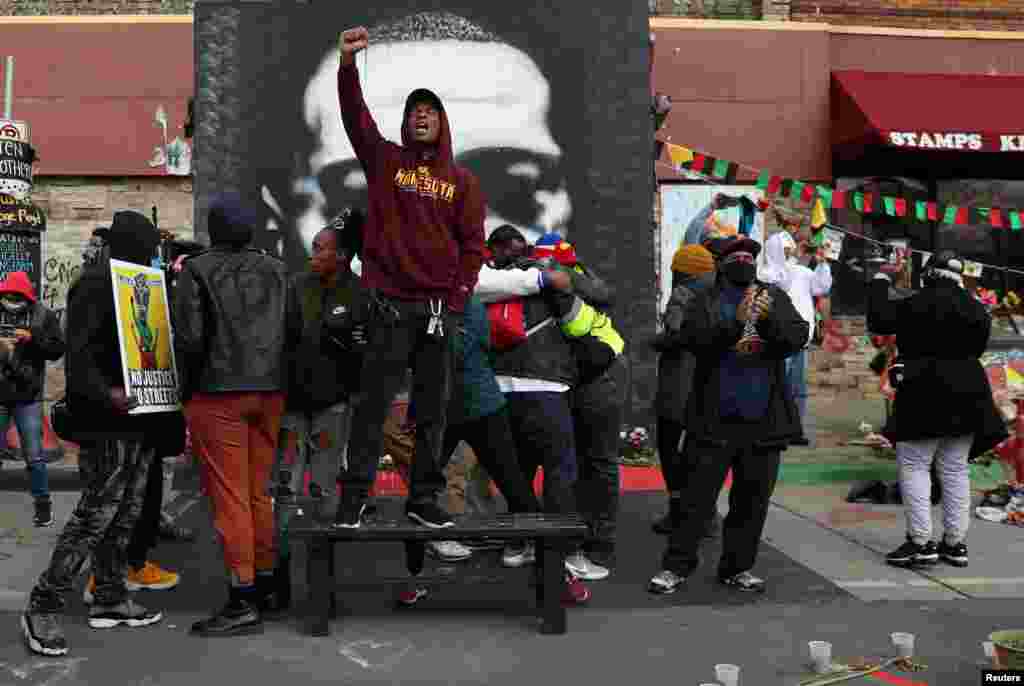 People react after the verdict in the trial of former Minneapolis police officer Derek Chauvin, found guilty of the death of George Floyd, at George Floyd Square in Minneapolis, Minnesota.