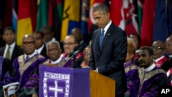 President Barack Obama pauses as he speaks during services honoring the life of Reverend Clementa Pinckney at the College of Charleston TD Arena in Charleston, S.C., June 26, 2015,