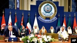 FILE - The closing session of the Arab League Summit at Bayan Palace, Kuwait, March 26, 2014.