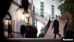 U.S. President Donald Trump walks as he returns from Florida to the White House, in Washington, Jan. 27, 2025. 