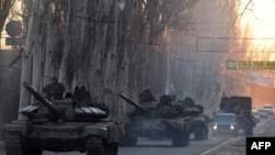 Ukraine - Pro-Russian separatists patrol a street in the eastern Ukrainian city of Makeyevka on February 18, 2015.