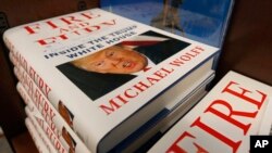 A stack of reserved "Fire and Fury" books by writer Michael Wolff sit on a shelf in a bookstore in Richmond, Va., Jan. 5, 2018.