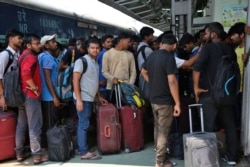 National Institute of Technology (NIT) students who left Srinagar, Kashmir's main city wait to leave for their respective homes at the railway station in Jammu, India, Aug. 4, 2019.