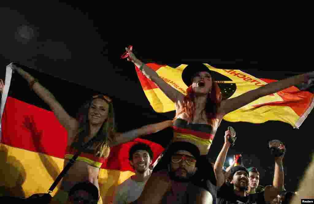 German fans celebrate their victory during a broadcast at Copacabana beach in Rio de Janeiro, June 30, 2014.