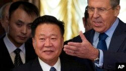 FILE - Russian Foreign Minister Sergei Lavrov, right, welcomes North Korean envoy Choe Ryong Hae during their meeting in Moscow, Nov. 20, 2014.